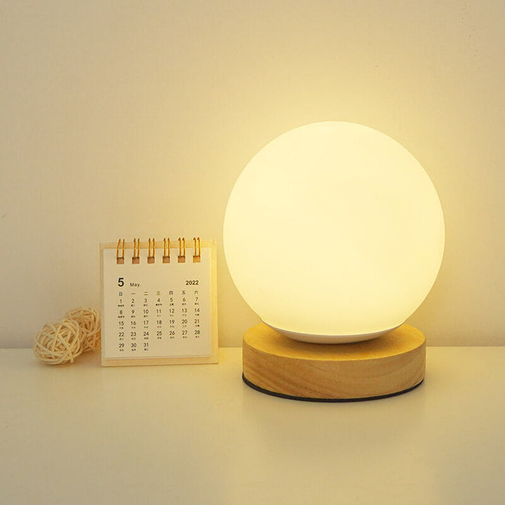 Nowoczesna minimalistyczna okrągła lampa biurkowa LED z możliwością ładowania przez USB