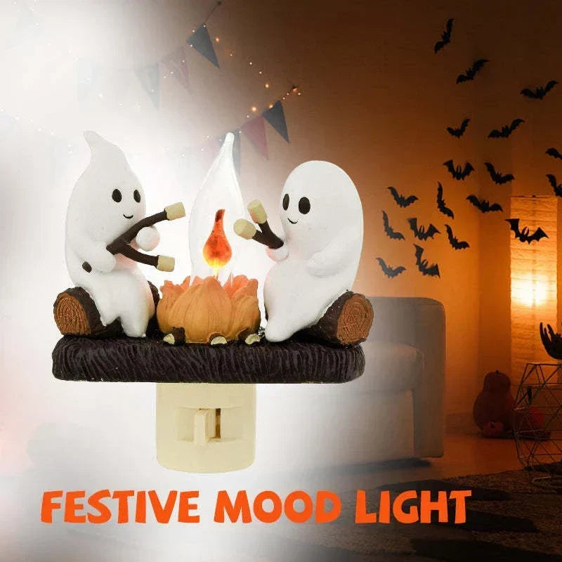 Lampka nocna z duchem przy ognisku
