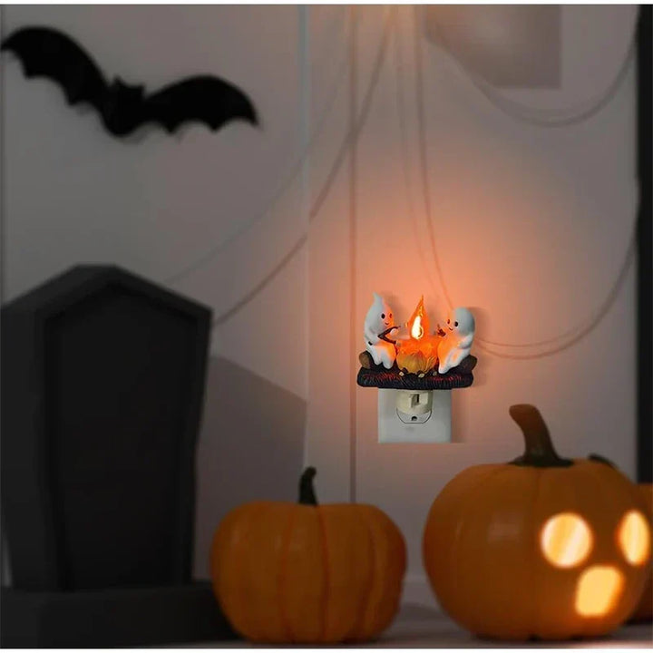 Lampka nocna z duchem przy ognisku