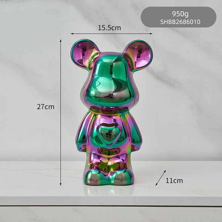 kolorowa rzeźba misia ceramicznego i skarbonka w formie statuetki na biurko