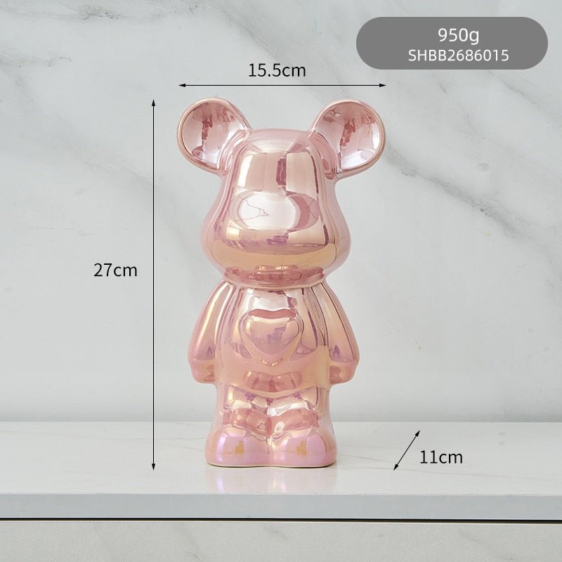 kolorowa rzeźba misia ceramicznego i skarbonka w formie statuetki na biurko