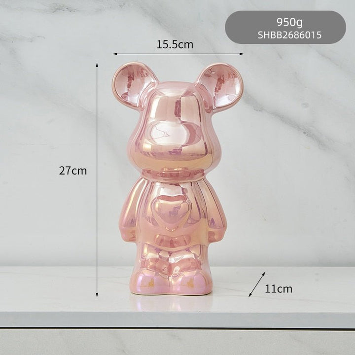 kolorowa rzeźba misia ceramicznego i skarbonka w formie statuetki na biurko