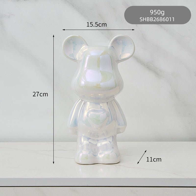 kolorowa rzeźba misia ceramicznego i skarbonka w formie statuetki na biurko