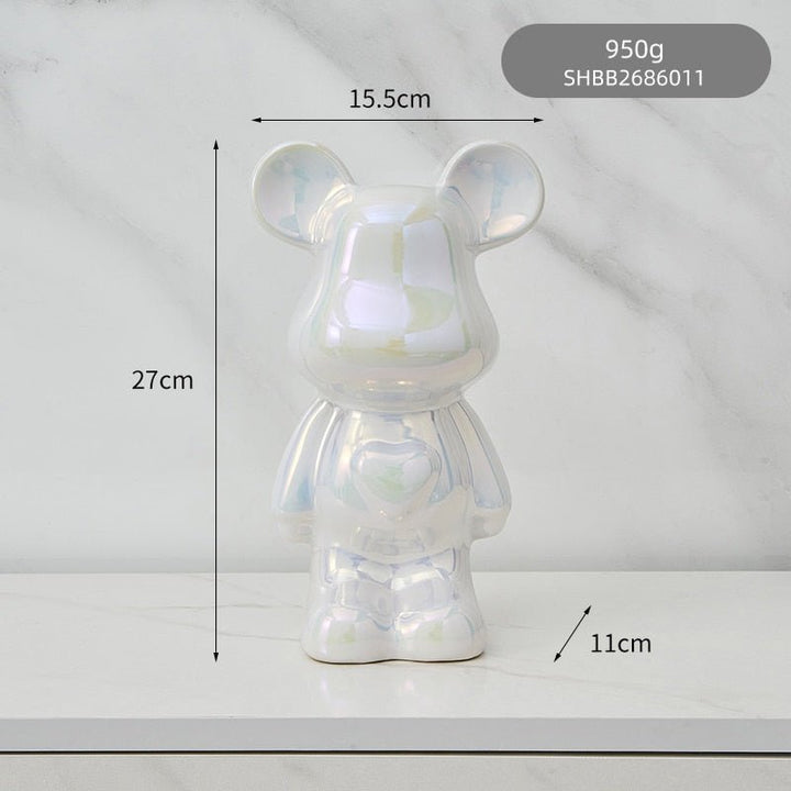 kolorowa rzeźba misia ceramicznego i skarbonka w formie statuetki na biurko