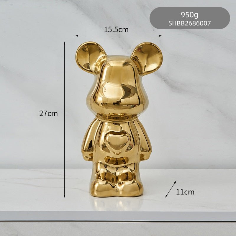 kolorowa rzeźba misia ceramicznego i skarbonka w formie statuetki na biurko