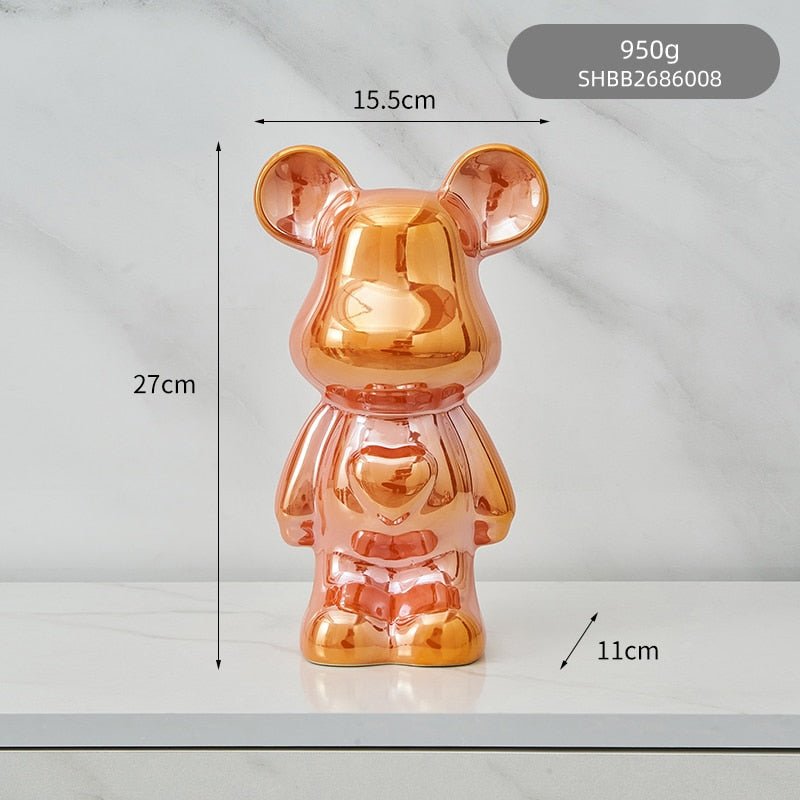 kolorowa rzeźba misia ceramicznego i skarbonka w formie statuetki na biurko