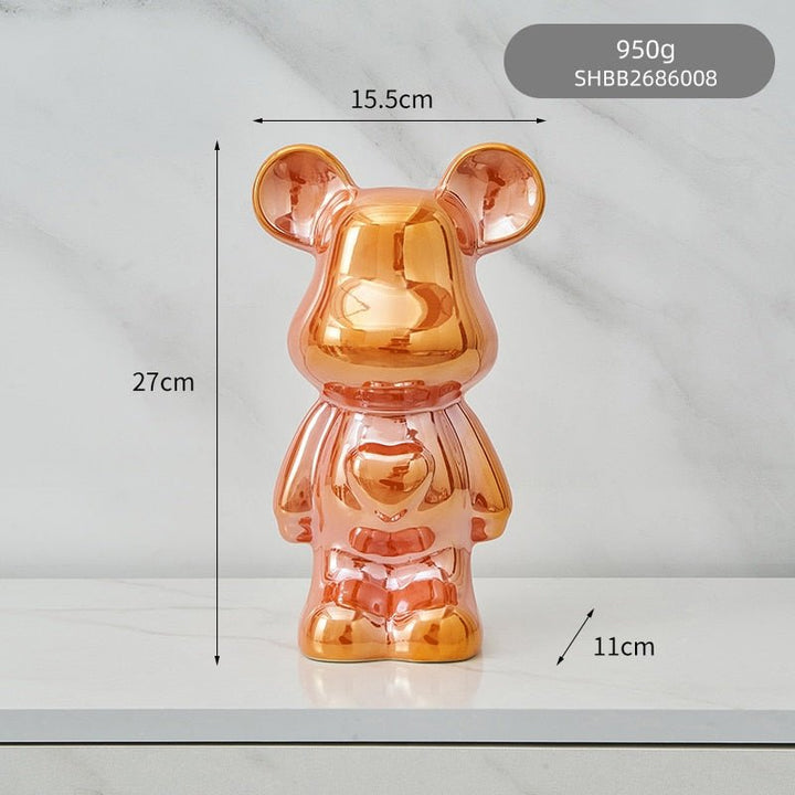 kolorowa rzeźba misia ceramicznego i skarbonka w formie statuetki na biurko