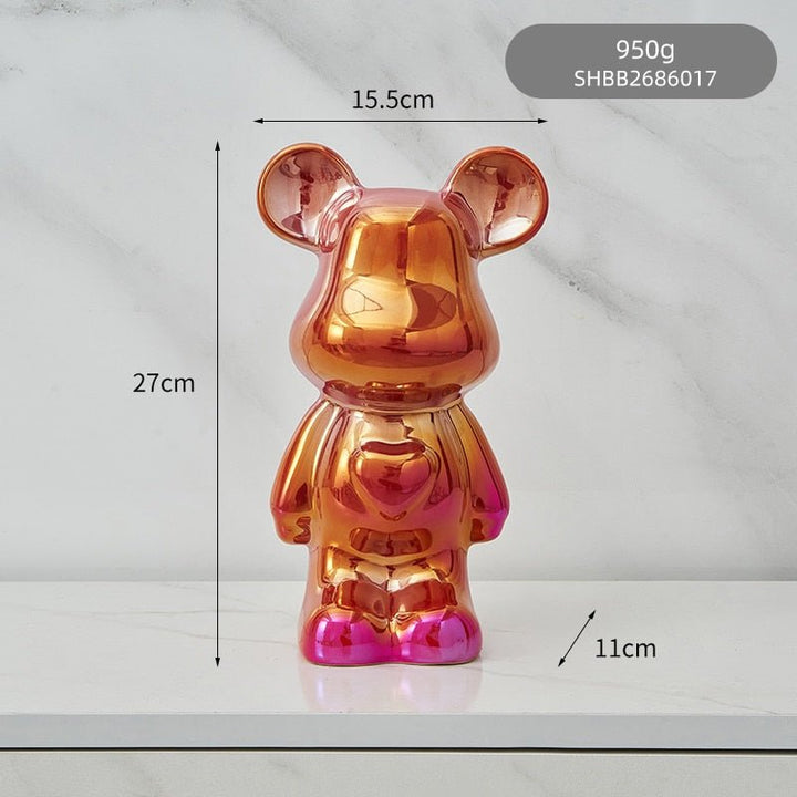 kolorowa rzeźba misia ceramicznego i skarbonka w formie statuetki na biurko